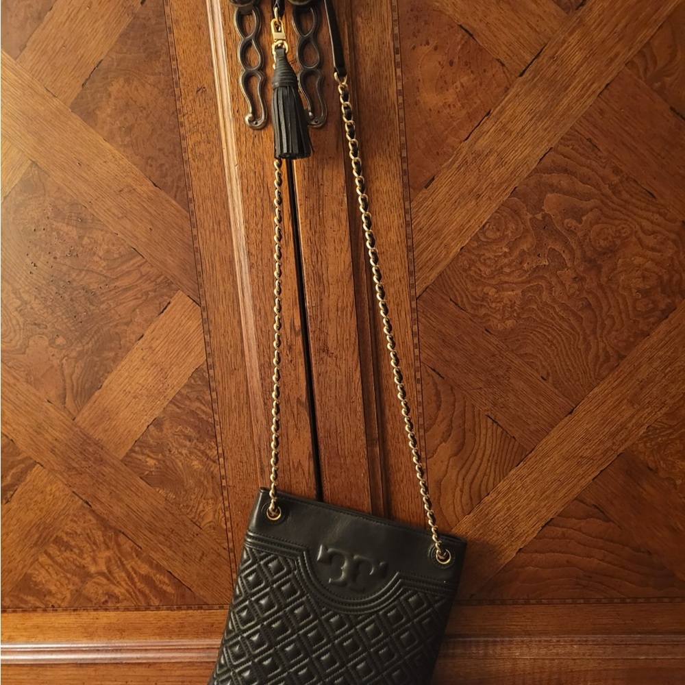 Tory Burch crossbody and yes an IPhone will fit inside